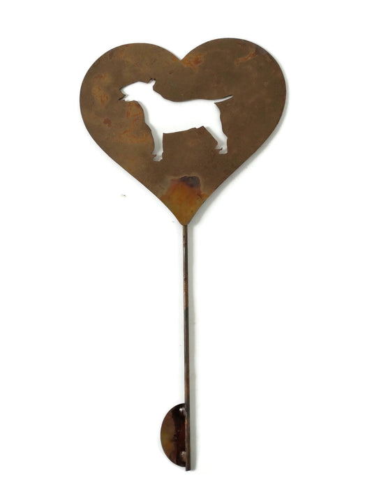 Heart-shaped rusty garden stake sign in rust with an english bull terrier dog silhouette