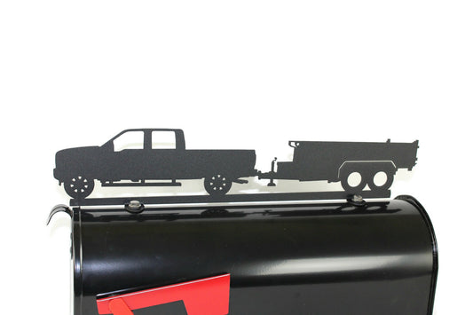Black pickup and dump trailer mailbox topper installed on a mailbox