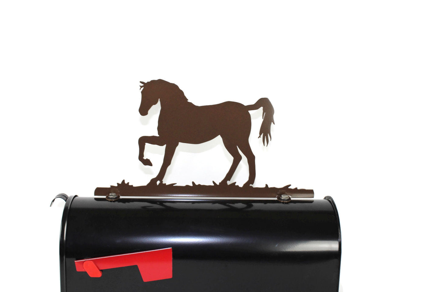 Hammered brown standing horse mailbox topper installed on a mailbox