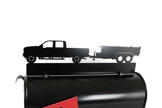 Black pickup and dump trailer custom mailbox topper installed on a mailbox