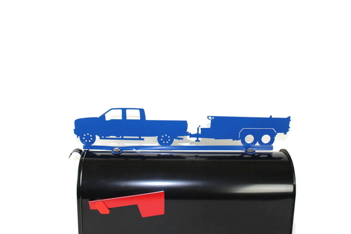 Blue pickup and dump trailer mailbox topper installed on a mailbox