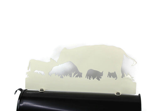 Cream cow and calf touching noses mailbox topper installed on a mailbox.