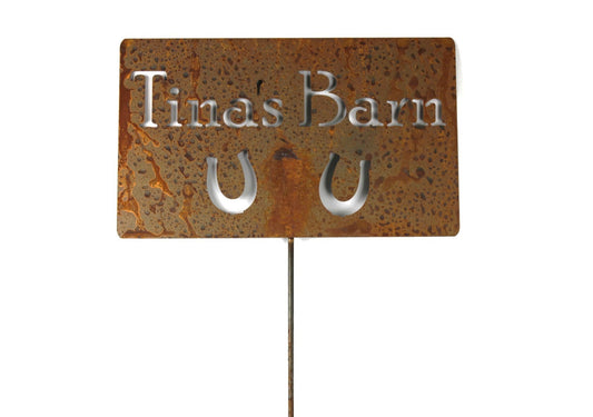 Custom metal garden stake in rust with horseshoes and Tina's Garden for text