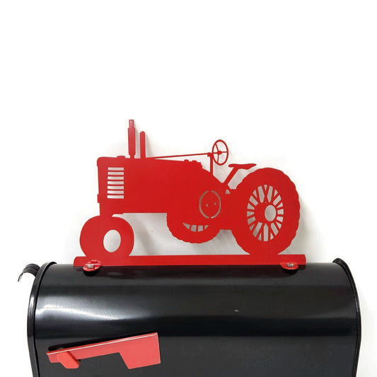 Red vintage tractor mailbox topper installed on a mailbox