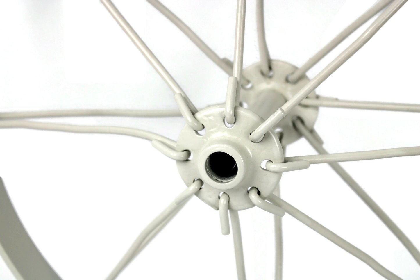 Metal antique farm wheel with spokes close up