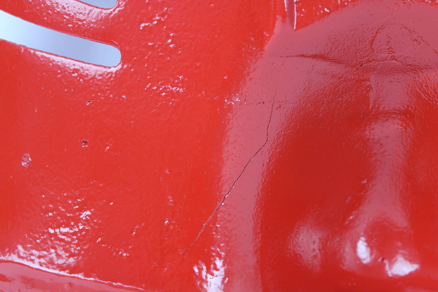 Red antique tractor seat close up