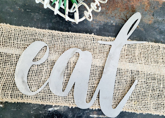 eat metal script word sign in raw steel