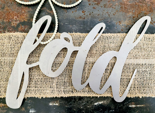 fold metal script word sign in raw steel