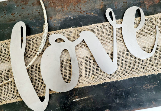 love metal script word sign in raw steel