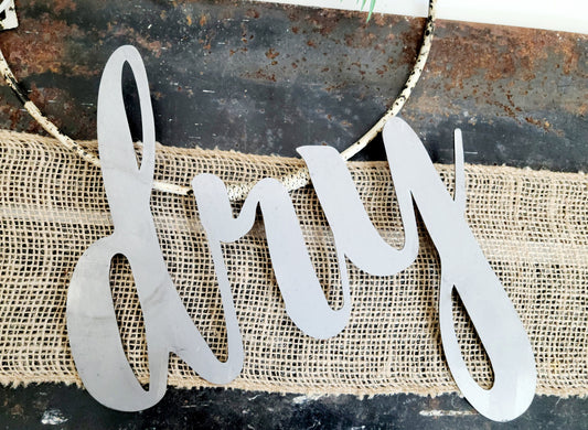 dry metal script word sign in raw steel