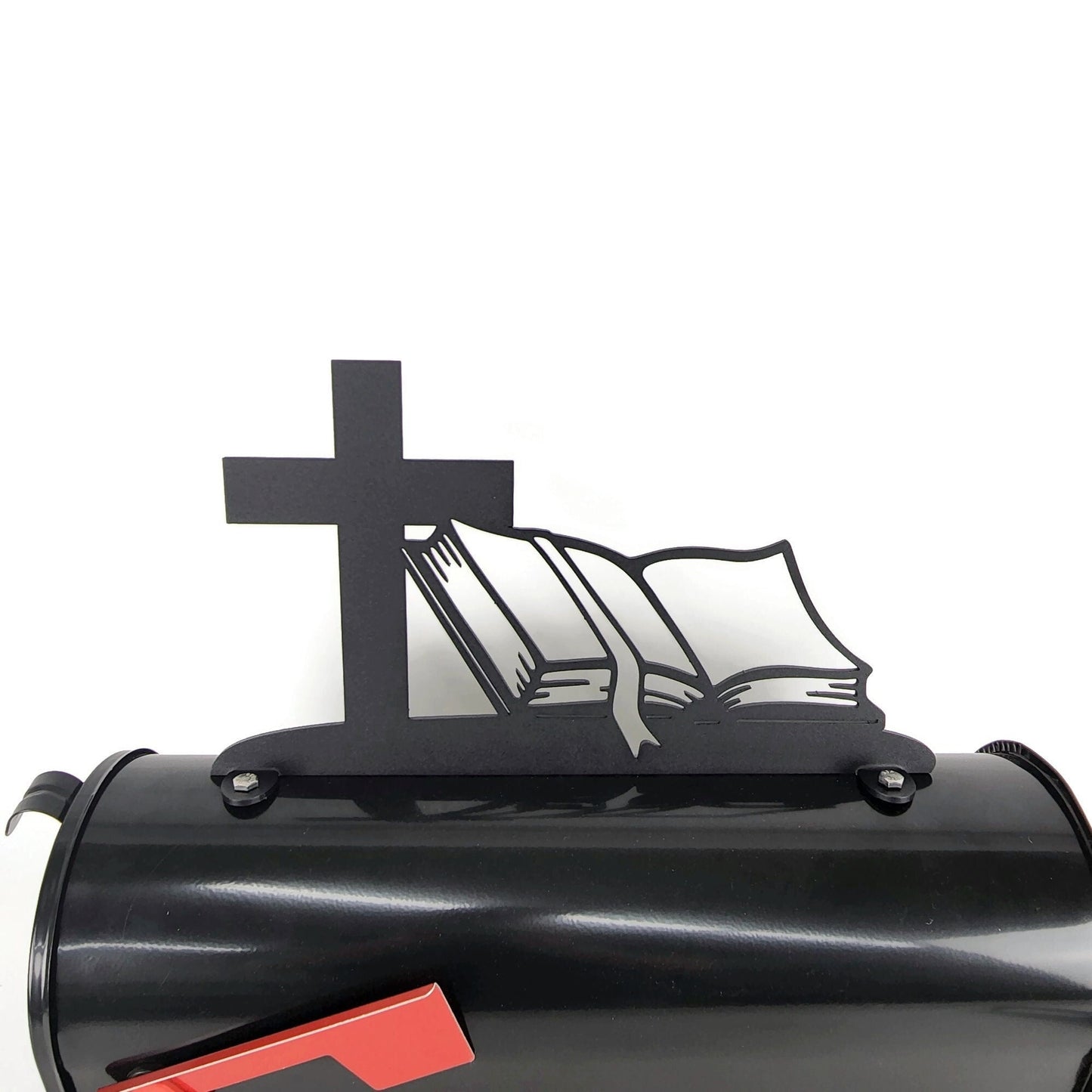 Black cross and bible mailbox topper installed on a mailbox.