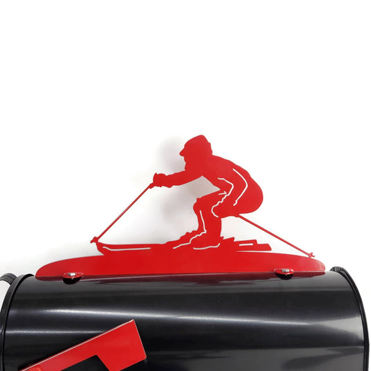 Red downhill skiing mailbox topper installed on a mailbox.