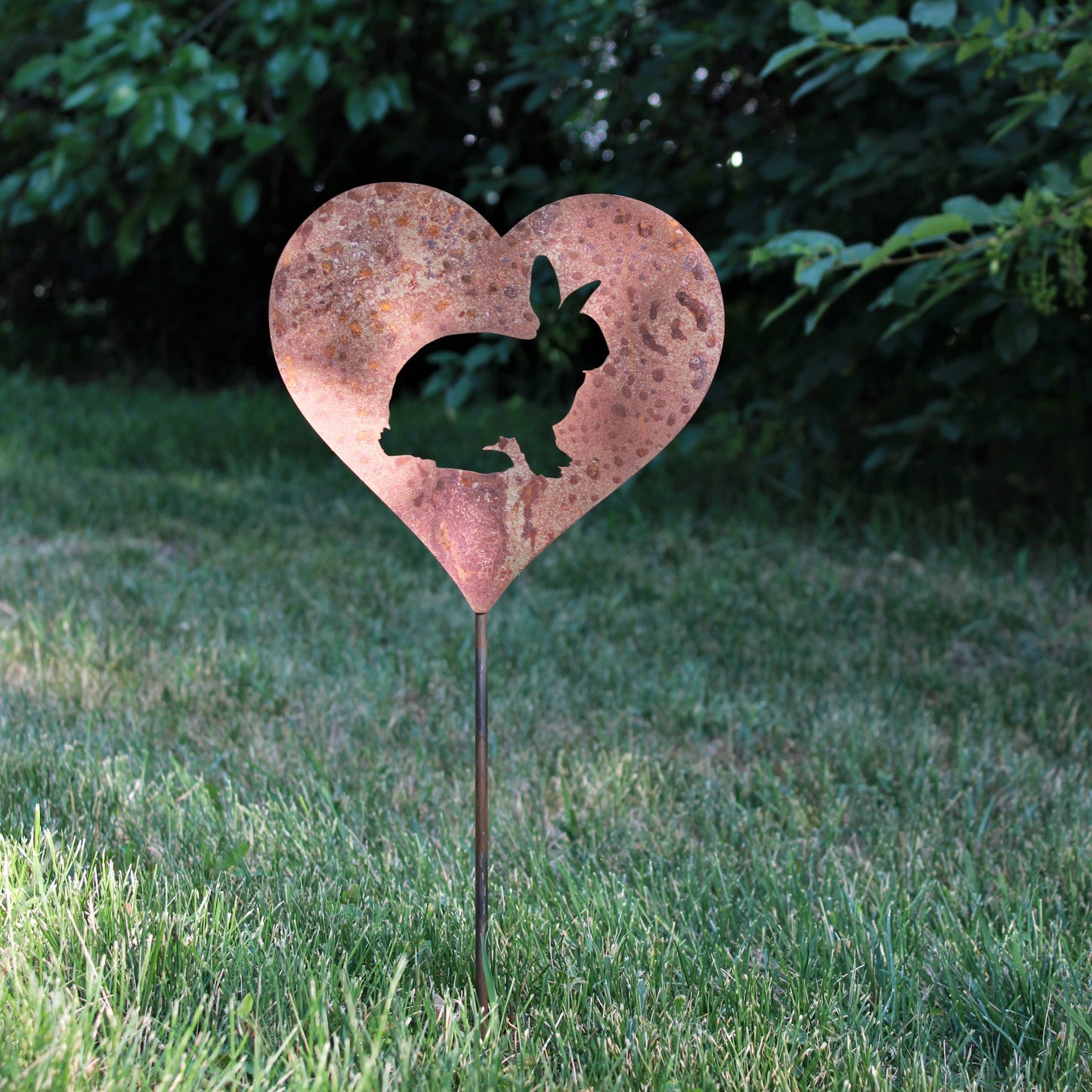 Custom heart-shaped rusty garden stake sign in rust with a bunny rabbit silhouette