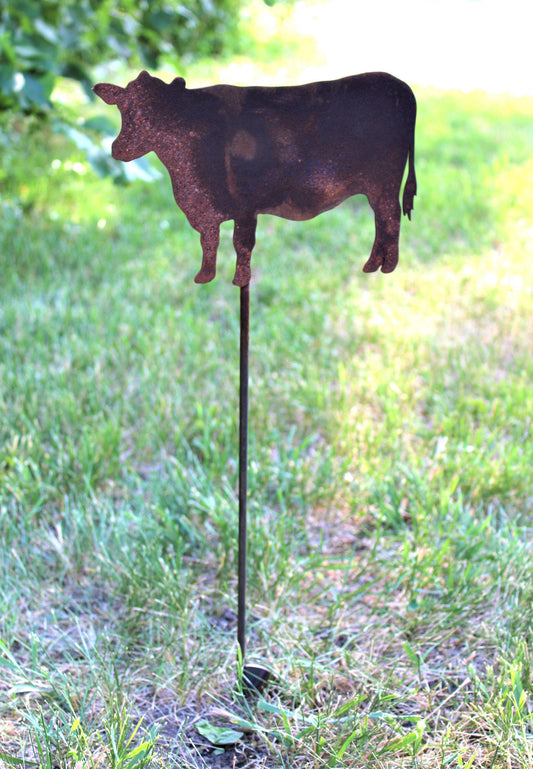 Rusty metal cow garden stake