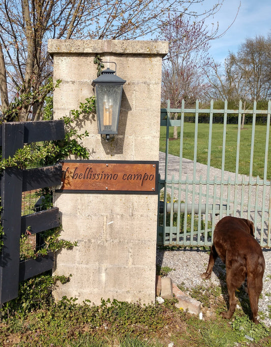 Rust over black metal layered name sign