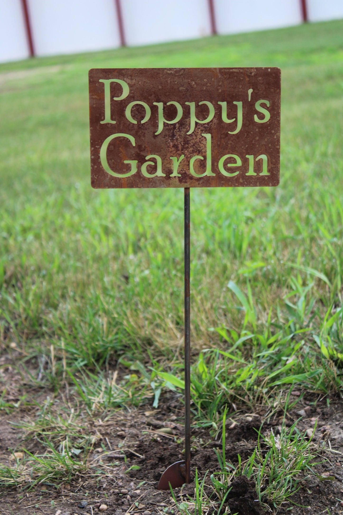 Poppy's Garden rusty garden stake sign