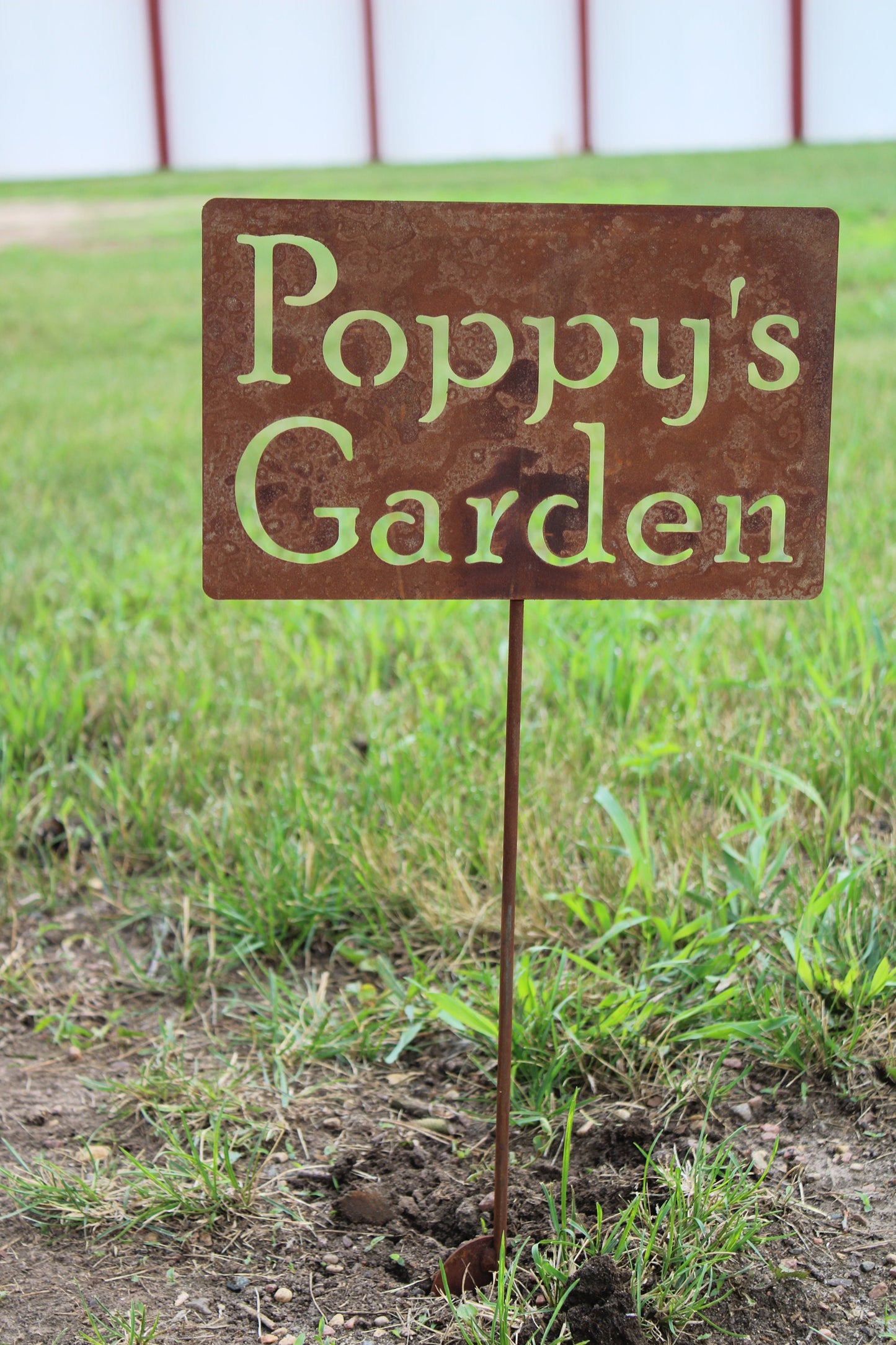 Poppy's Garden rusty garden stake sign