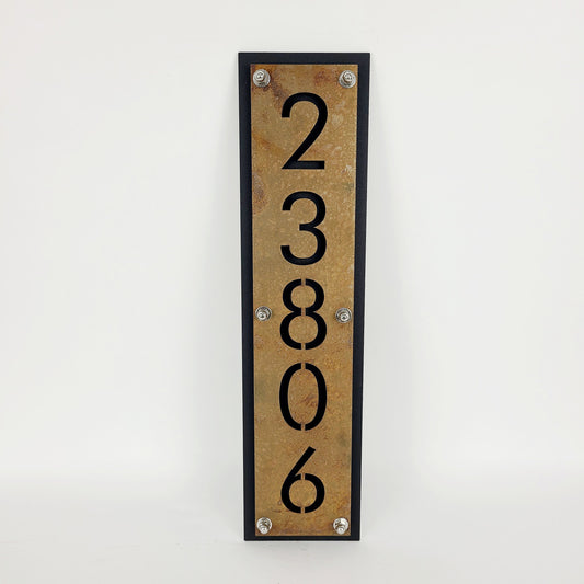 Rust over black vertical layered metal address sign