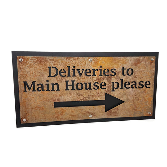 Rust over black layered metal direction sign