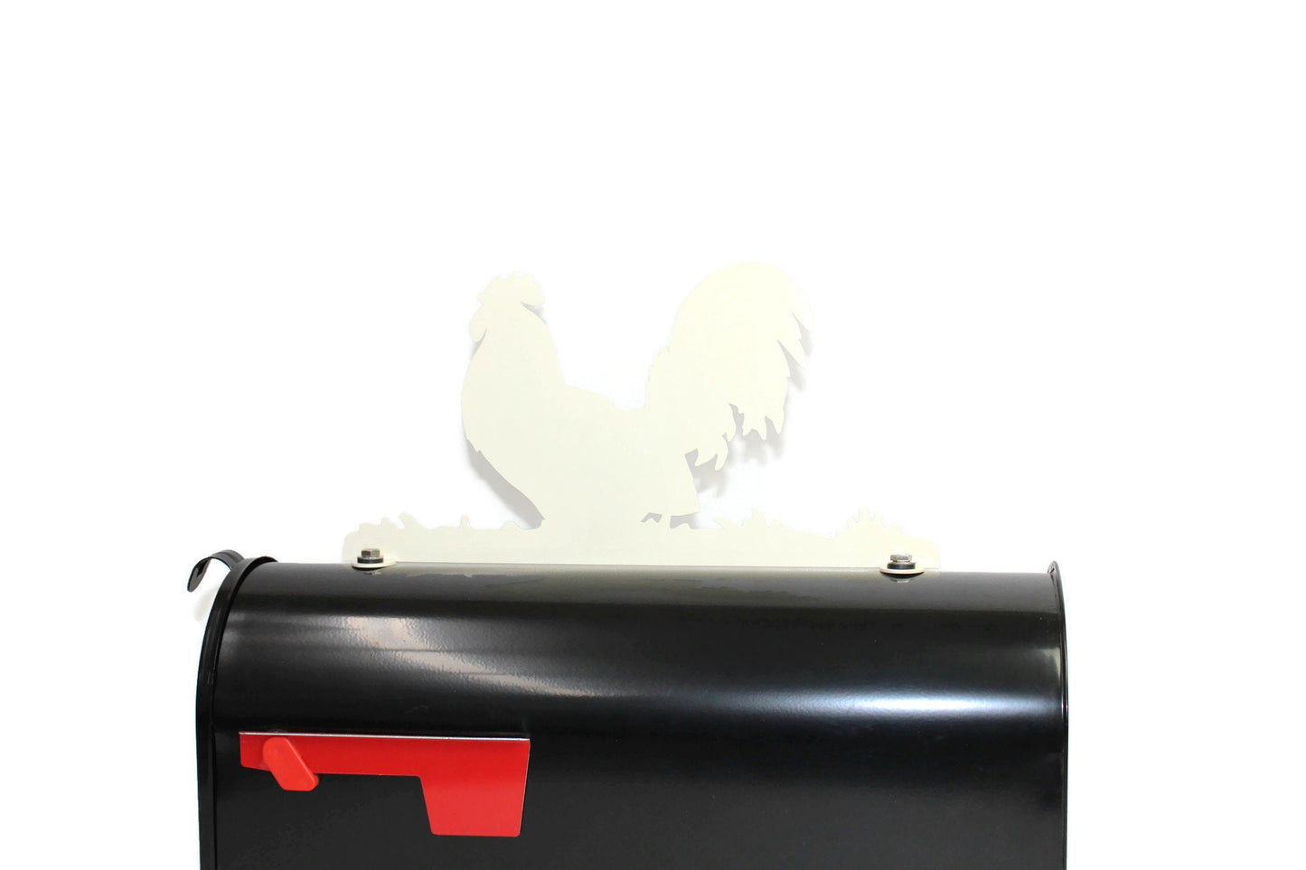 Cream rooster mailbox topper installed on a mailbox
