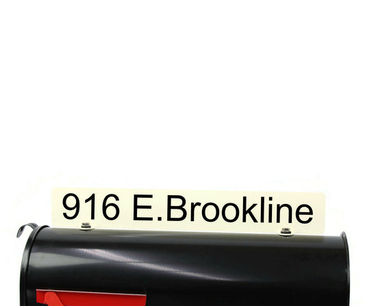 Cream custom mailbox topper with custom address installed on a mailbox.