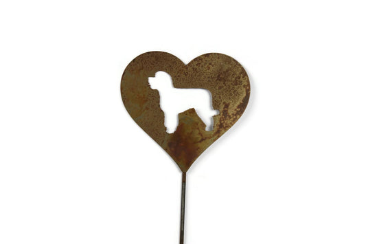 Heart-shaped rusty garden stake sign in rust with a portugese water dog silhouette