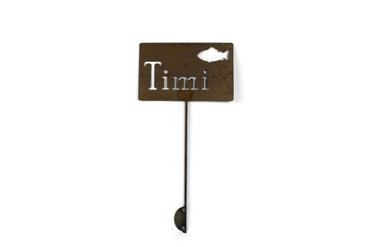 Custom metal garden stake in rust with a fish and Timi for text