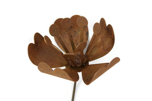 Daffodil and magnolia flower inspired rusty metal garden stake