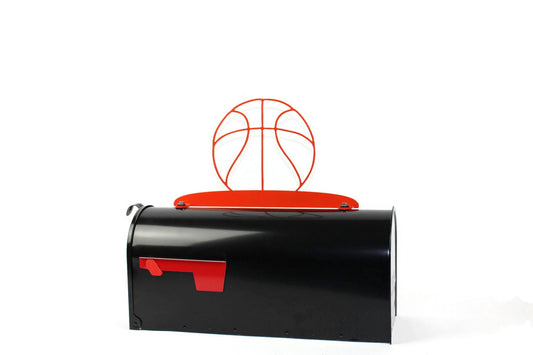 Orange basketball mailbox topper installed on a mailbox.