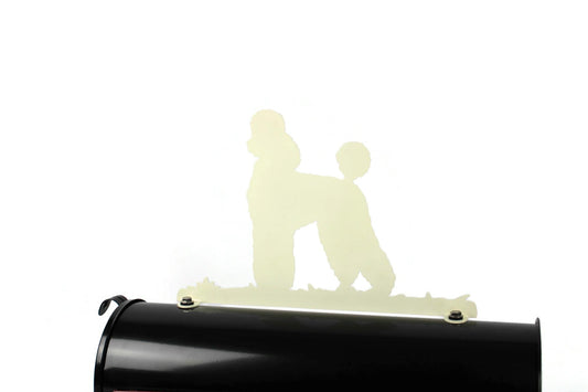 Cream poodle mailbox topper installed on a mailbox