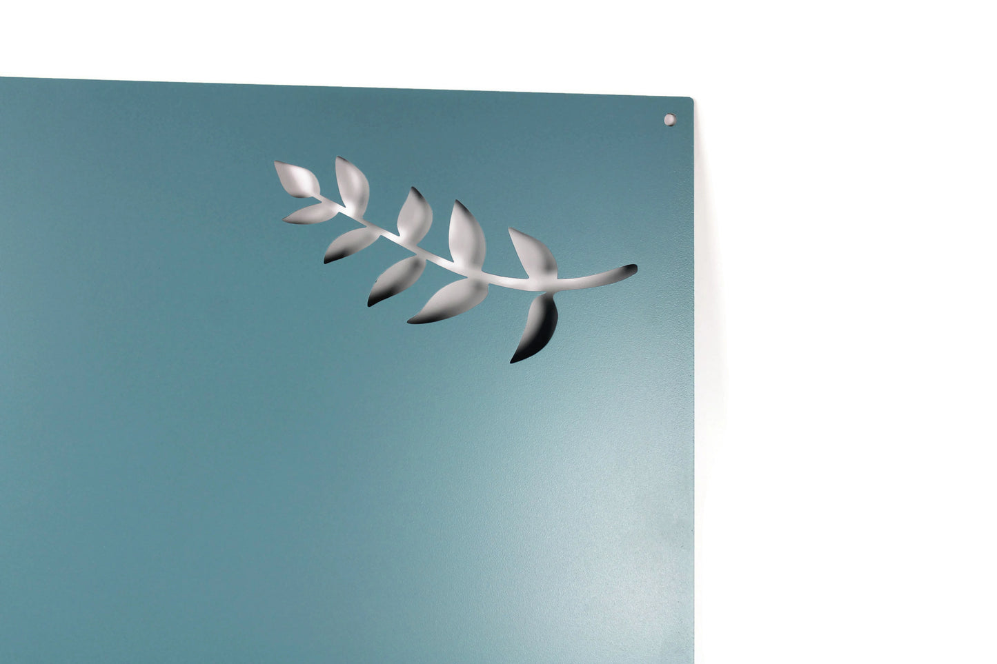 Light blue powder coat metal magnet message board with leaf pattern close up