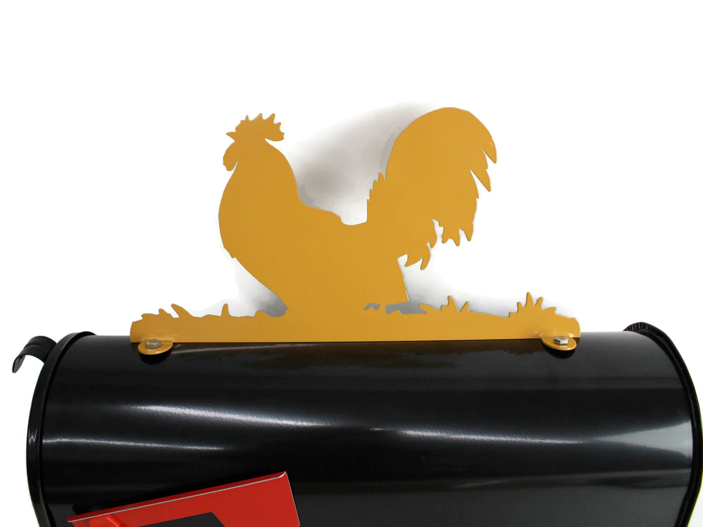 Dark yellow rooster mailbox topper installed on a mailbox