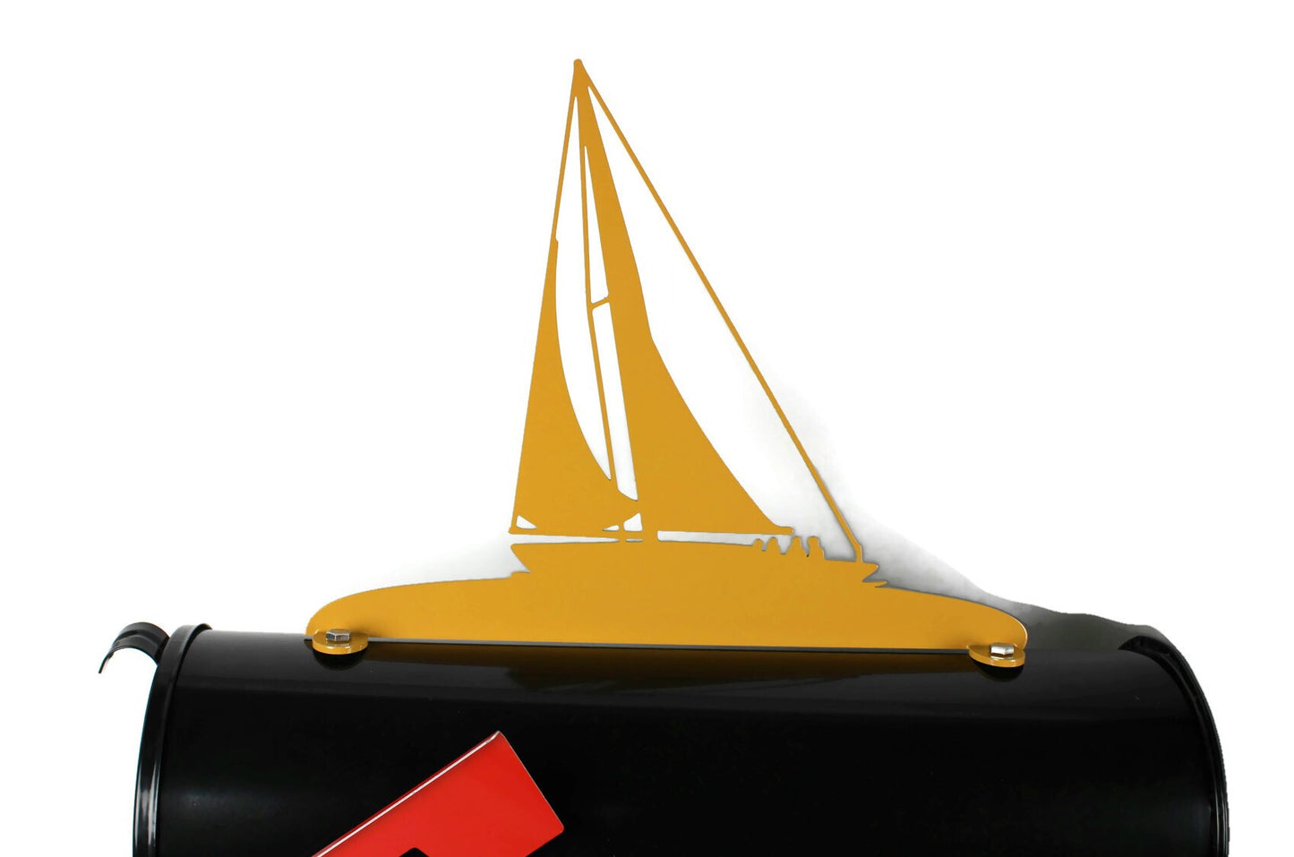 Dark yellow sailboat mailbox topper installed on a mailbox