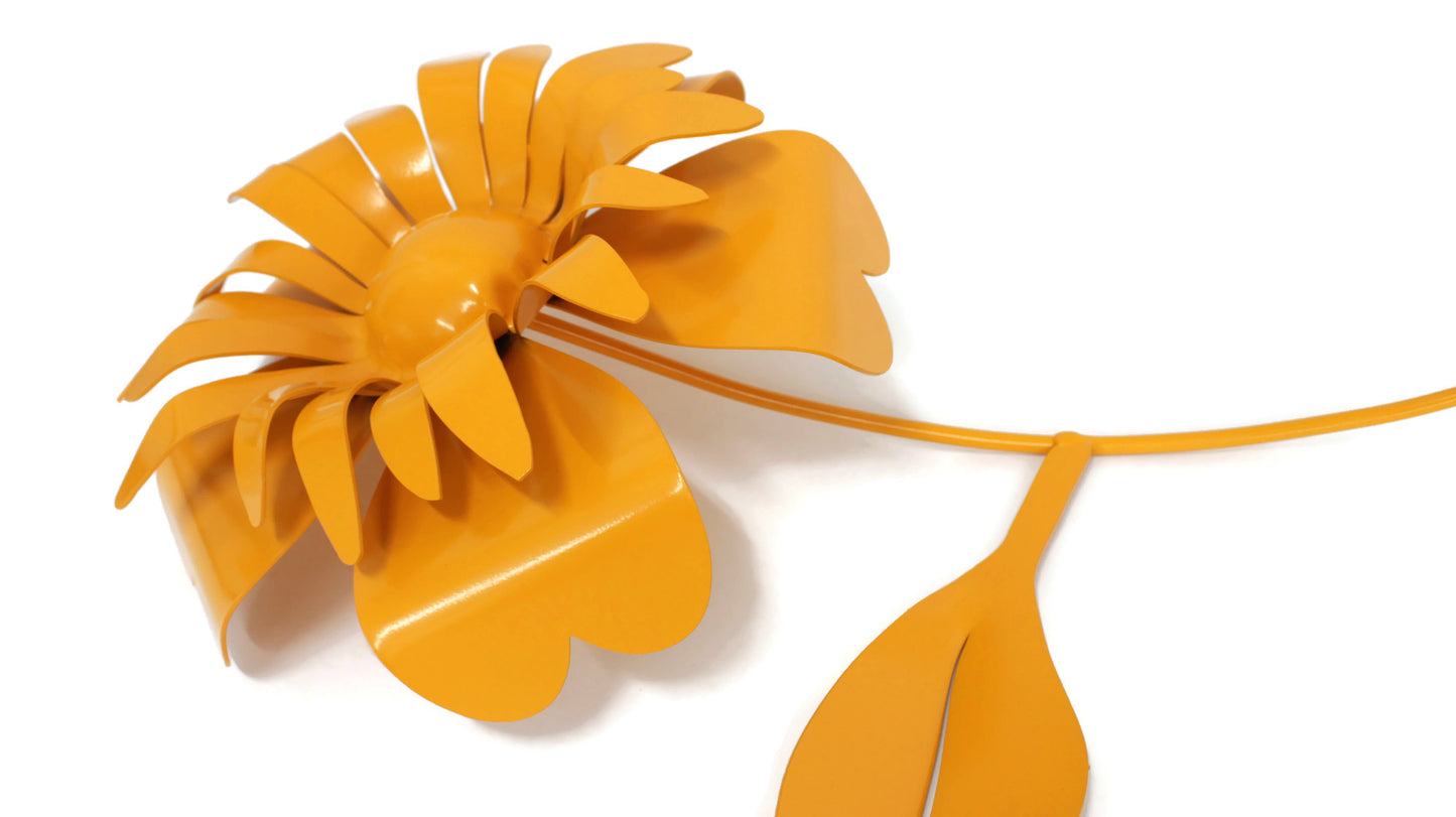 Close up of dark yellow powder coat metal sunflower garden stake
