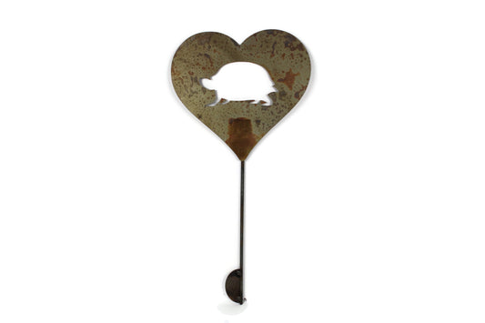 Heart-shaped rusty garden stake sign in rust with a turtle tortoise silhouette