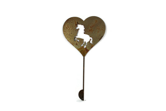 Heart-shaped rusty garden stake sign in rust with a unicorn silhouette