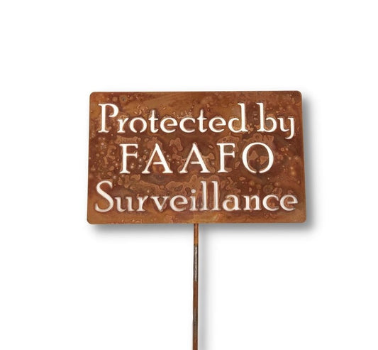 Protected By FAAFO Surveillance rusty garden stake sign