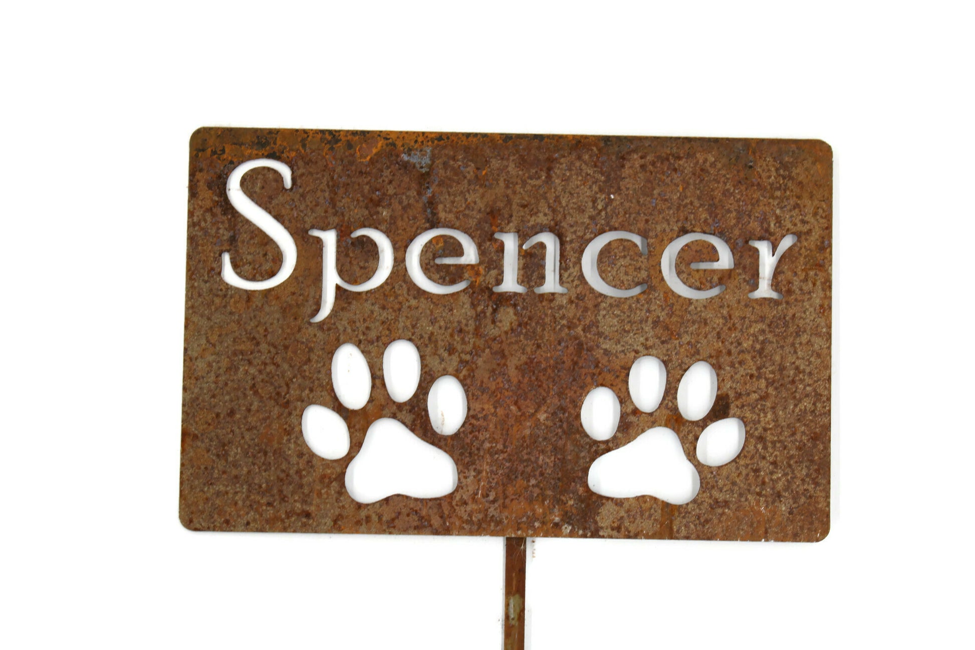 Spencer with two paw prints rusted garden stake sign