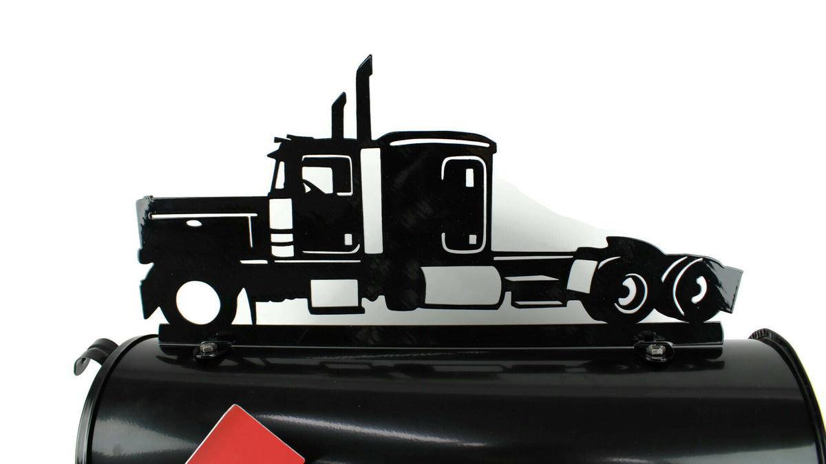 Black semi truck mailbox topper installed on a mailbox