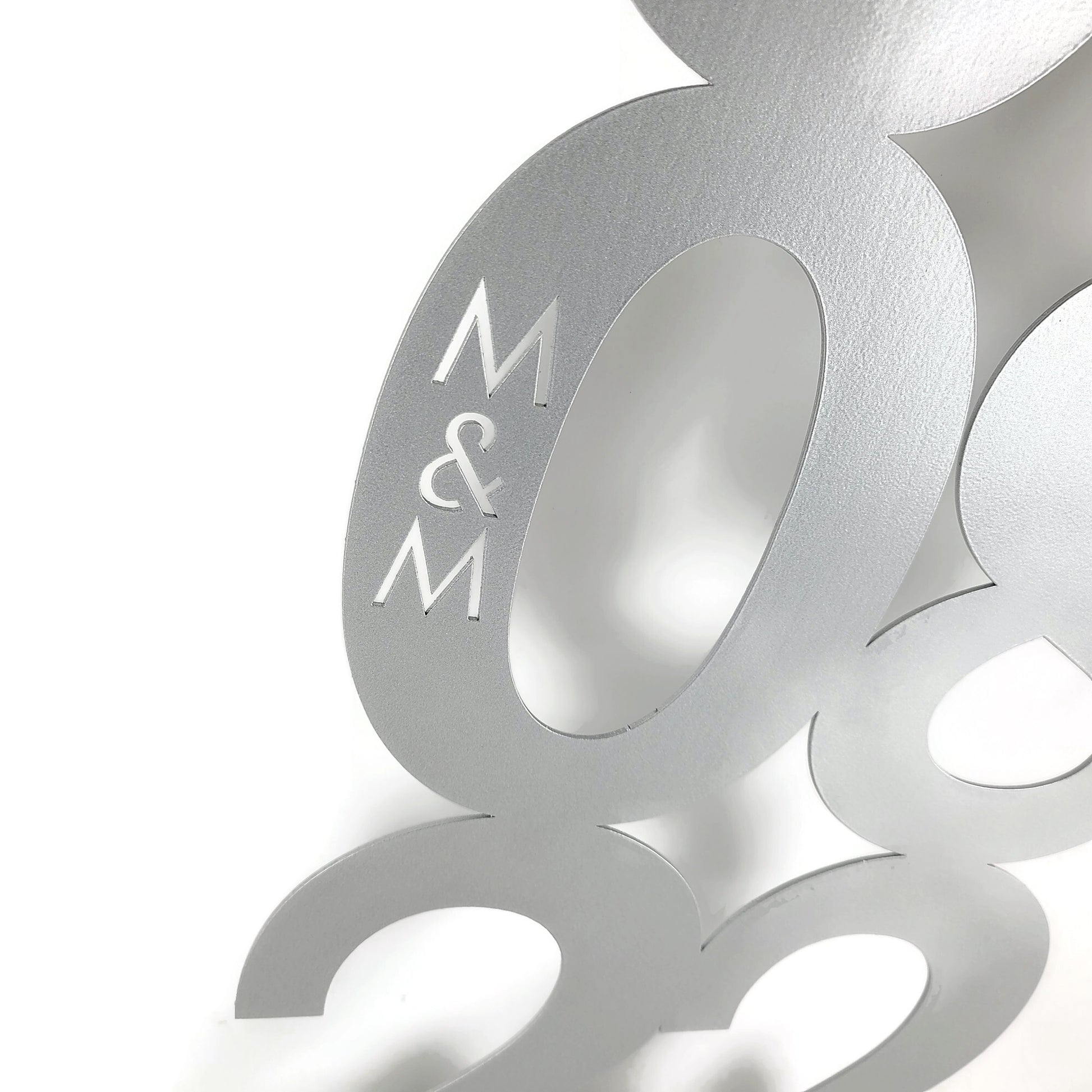Silver powder coat metal wall art with anniversary date with initials close up