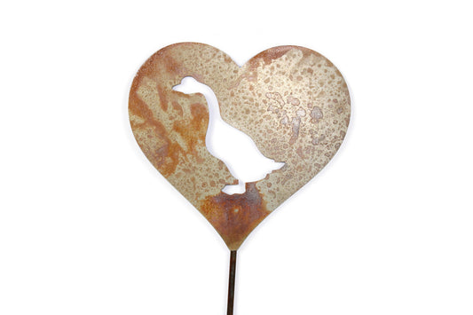 Heart-shaped rusty garden stake sign in rust with a goose silhouette