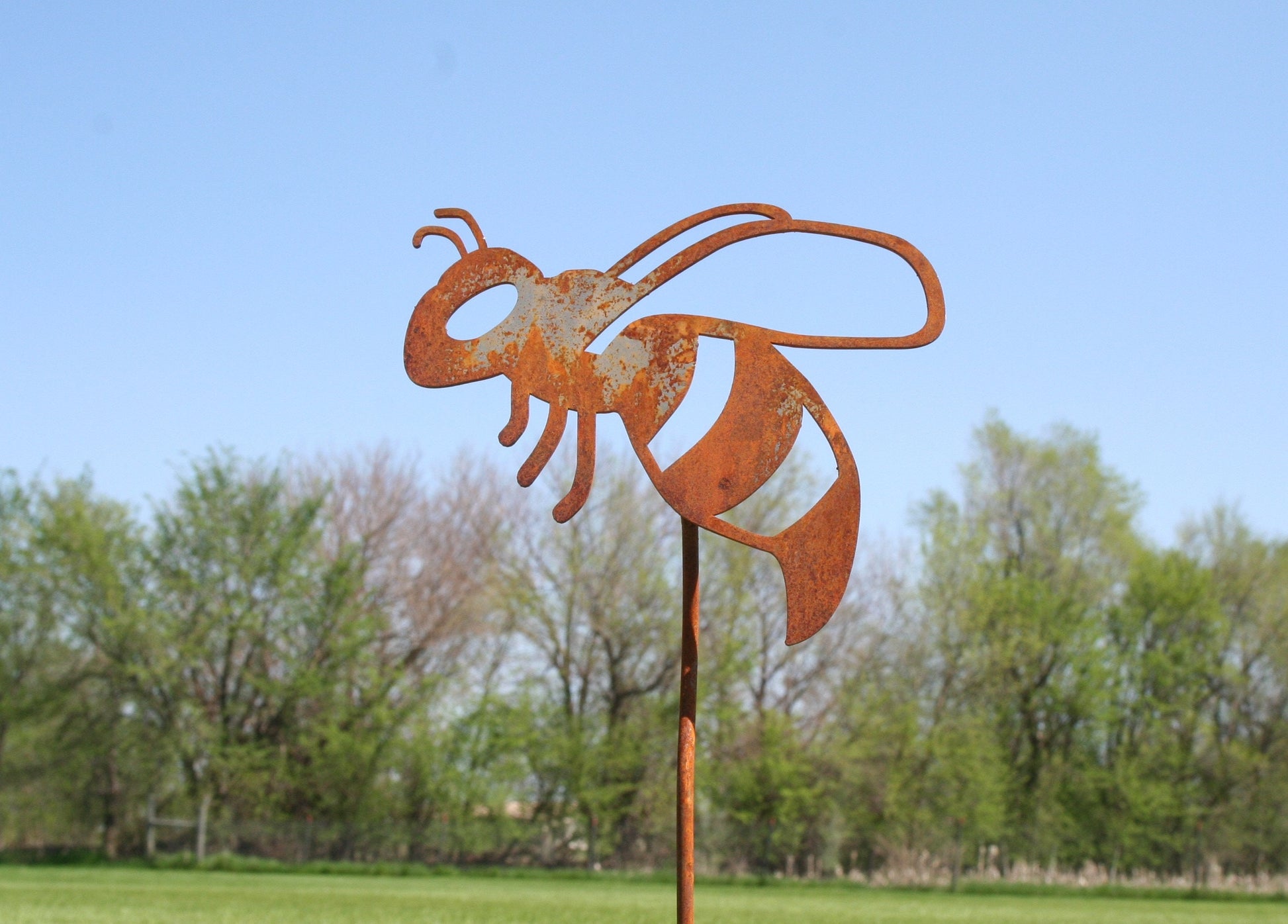Rusty metal honey bee stake
