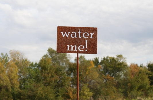 water me rusty garden stake sign