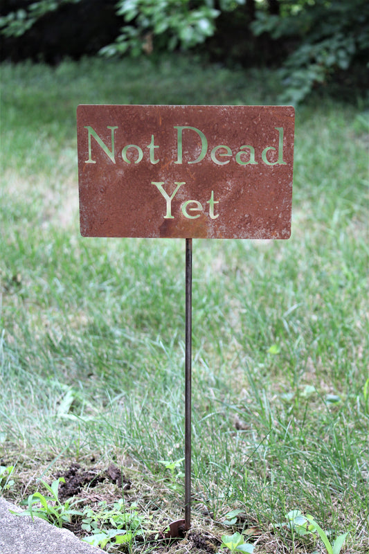 Not Dead Yet rusty garden stake sign