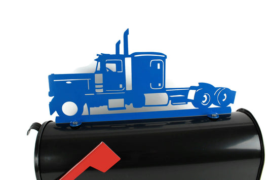 Blue semi truck mailbox topper installed on a mailbox