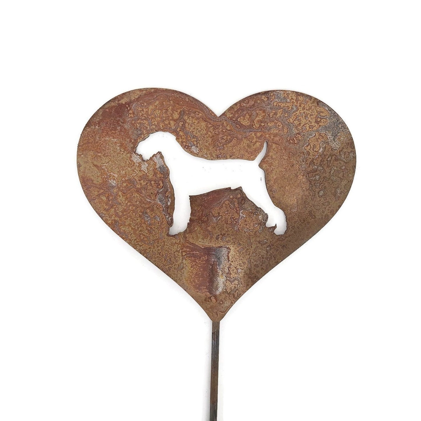 Heart-shaped rusty garden stake sign in rust with an airedale dog silhouette