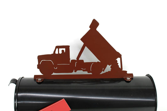 Hammered brown dump truck mailbox topper installed on a mailbox.