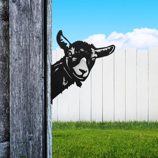 Black powder coat metal goat head peeking around a tree