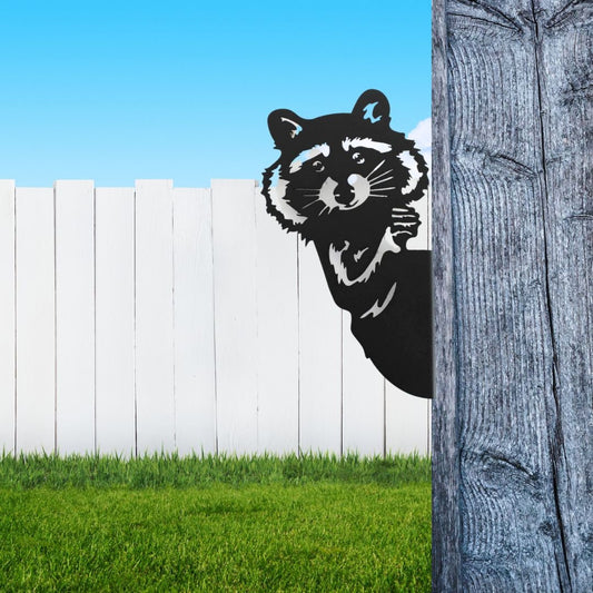 Black powder coat metal raccoon peeking around a tree