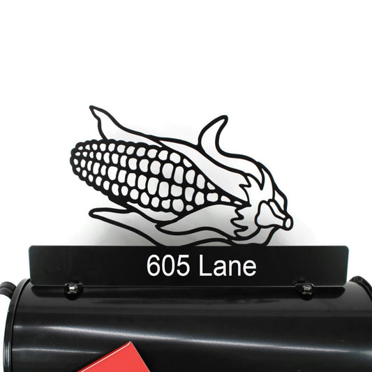 Black ear of corn custom mailbox topper with address installed on a mailbox.